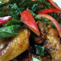Y11. Chicken Wing with Thai Basil · Spicy. Grazed chicken wings stir fried with chili, garlic, Thai basil, and topped with crisp...