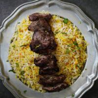 Kabob Harouf · Lamb kabab with butter-garlic sauce. Served with rice pilaf and daily vegetable.