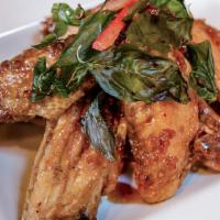 Spicy Wings · Crispy chicken wings, sautéed with fresh chili, garlic sauce and topped with crispy sweet ba...