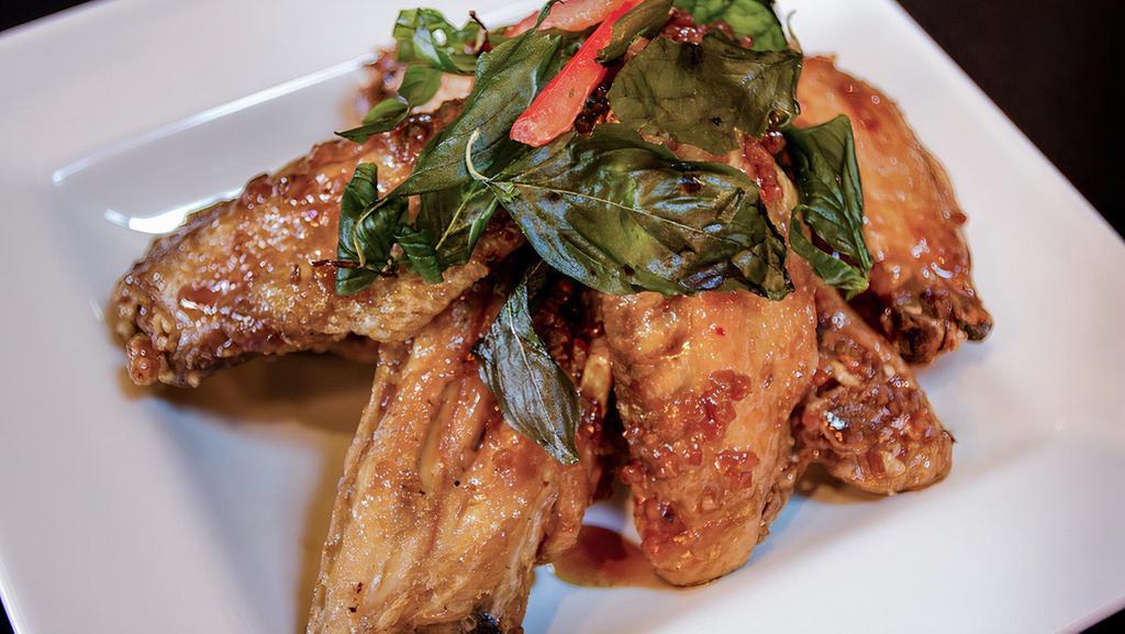 Spicy Wings · Crispy chicken wings, sautéed with fresh chili, garlic sauce and topped with crispy sweet basil.