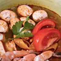 Tom Yum Soup · Hot and sour soup with mushrooms, tomatoes, lemongrass, galanga-from the ginger family and l...