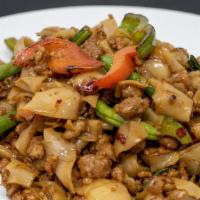 32. Pad Kee Mao Noodles · Stir fried flat rice noodles with green beans, bell peppers, Thai chili and sweet basil. Cho...