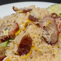 36. Barbeque Pork Fried Rice · Fried rice with barbeque pork and chinese sausage, egg, onions, tomatoes, and crab paste, to...