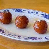 Gulab Jamun · Caramelized milk balls in sweet syrup.