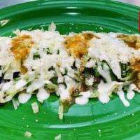 Huarache de Asada  · Handmade corn and flour mix tortilla topped with Carne Asada, queso fresco, onions, sour cre...