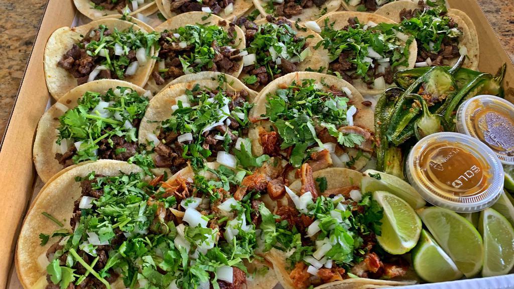 Taco Box Special · 15 tacos on corn tortilla with your choice of meat topped with onions and cilantro. Side with grilled jalapeños, salsa, and limes.

***Choice of meat: Carnitas, Pastor, Chicken, and chorizo only.
