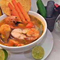 Caldo de 7 Mares · Delicious seafood soup with catfish, shrimp, crab, squid, octopus, and shelled mussels with ...