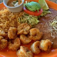 Breaded Shrimp plate · Delicious shrimp fried with breaded crumbs served with a side of rice, beans, a small salad ...