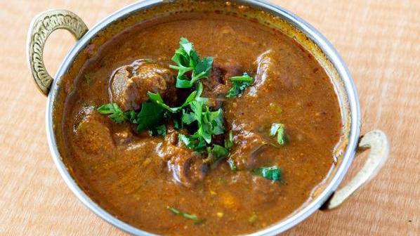 Lamb Curry · Lamb cooked with onion and tomato gravy.