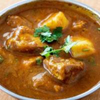 Chicken Vindaloo · Chicken cooked with hot spices and vinegar.