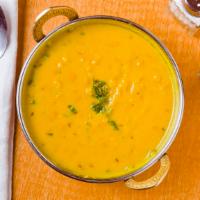 Yellow Daal Tadka · Tempered yellow lentils with cumin and fresh tomatoes.