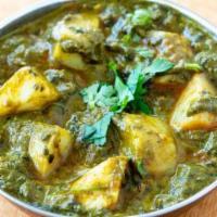 Aloo Palak · Spinach and potatoes cooked with Indian spices.