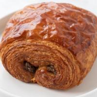 Pain au Chocolat · Pieces of rich chocolate are tucked inside croissant dough before baking.