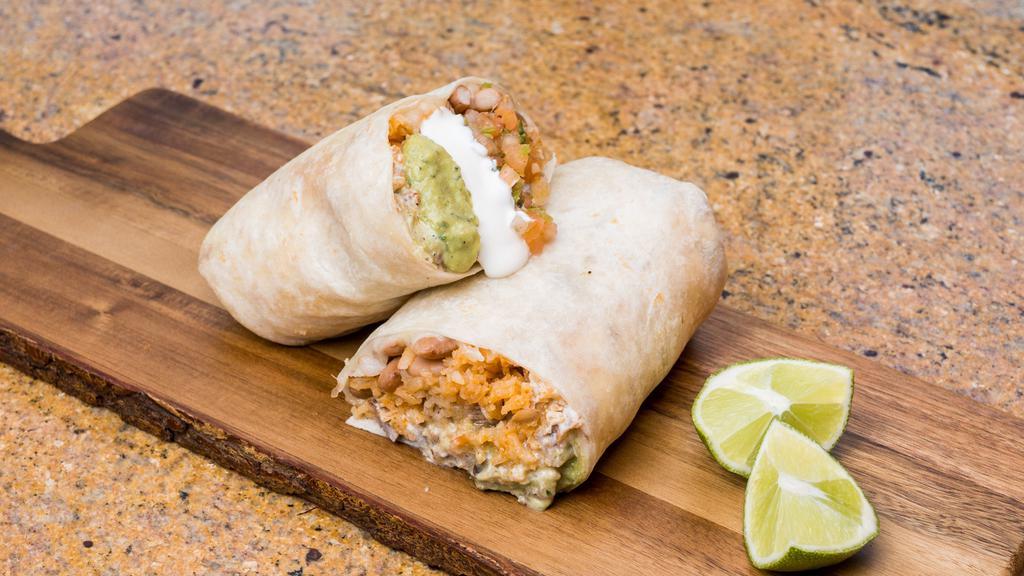 Super Burrito · Whole Beans, rice, fresh salsa, cheese, guac, sour cream, and choice of meat.