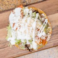 Tostadas · Crispy corn tortilla, with refried beans, lettuce, tomato, avocado, sour cream, cheese and y...