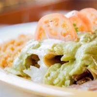 Flautas · Rolled Taquitos filled with chicken or beef, topped with salsa, guac, sour cream, lettuce, w...