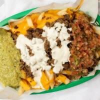 Super Nacho Fries · Black Beans, cheese, guac, sour cream, salsa, and your choice of meat.