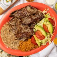 Plates · Your choice of meat, beans and rice. Choice of flour or corn tortillas.