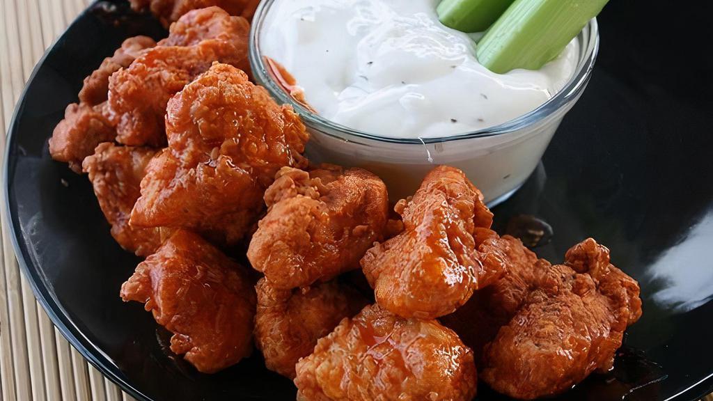 10 Pc Boneless Wings Combo (Not Halal) · tossed in wing sauce. Includes fries & 1 can soda