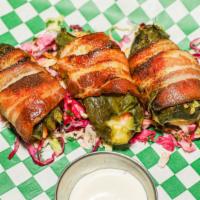 Jalapeños Rellenos · Three jalapeños, stuffed with a shrimp, Oaxaca and goat cheese, and wrapped with bacon.