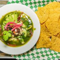 Aguachile De Pulpo Y Camarón · Shrimp and octopus marinated with lime juice and chilies, served with pickled onions, cucumb...