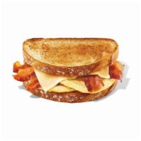 Sourdough Breakfast Sandwich · Two eggs, five half slices of bacon and white cheddar on two pieces of sourdough toast. Max ...