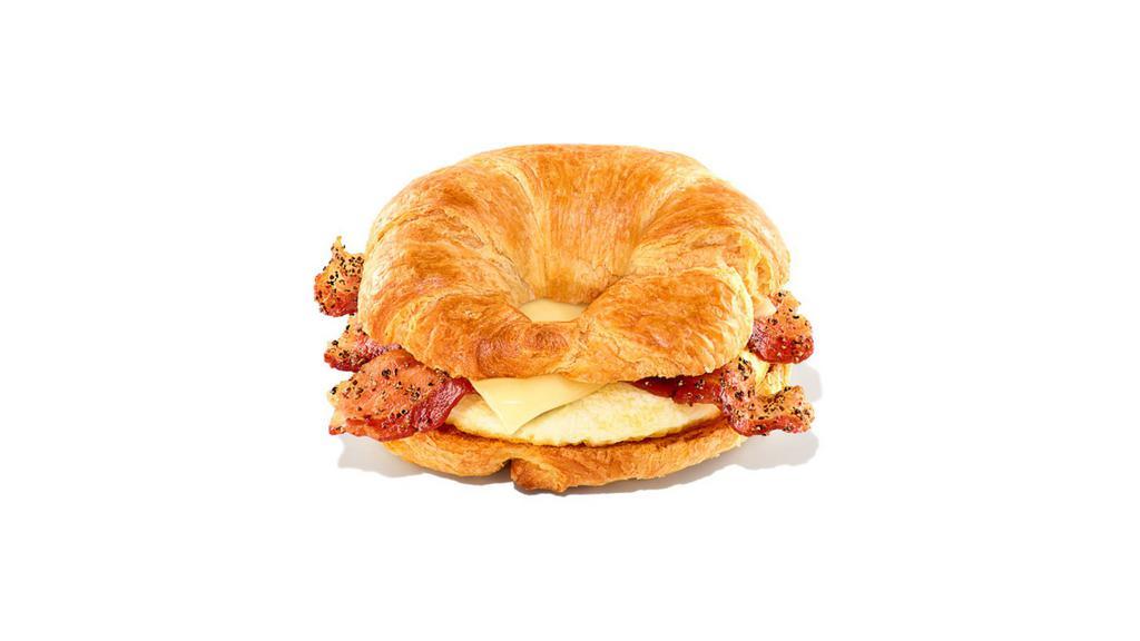 Sweet Black Pepper Bacon Breakfast Sandwich · Extra bacon caramelized with sweet black pepper seasoning with egg and cheese on a buttery croissant.