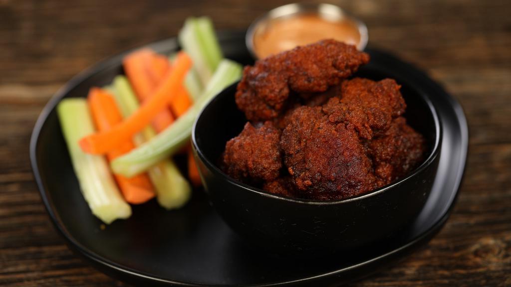 Boneless Nashville Hot Wings · 8 piece Nashville hot wings - medium heat. Come with 8  classic style bone-in wings, carrots and celery, and choice of blue cheese or ranch for dipping.