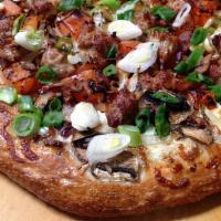 Sausage Alfredo Pizza · Garlic white sauce, mushrooms, red onions, tomatoes, bacon, Italian sausage and fresh green ...