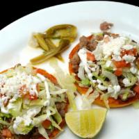  sopes · choice meat, cheese, lettuce, sour cream, red sauce,  pico de Gallo and fresh cheese.
