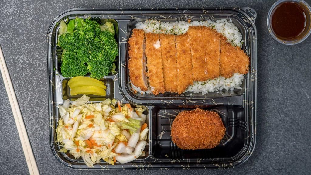 Tonkatsu Traditional Box · Breaded deep-fried pork cutlet served with katsu sauce, side salad, broccoli, steamed rice with Japanese furikake seasoning, and one croquette.