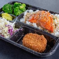 Salmon Bento Box · Fresh Atlantic Salmon w/ a teriyaki glaze.  Comes with a potato croquette, side salad, seaso...