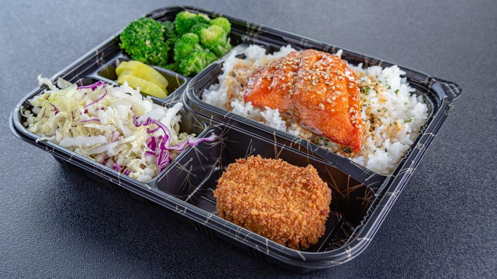 Salmon Bento Box · Fresh Atlantic Salmon w/ a teriyaki glaze.  Comes with a potato croquette, side salad, seasoned broccoli, and rice.