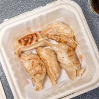 Gyoza · Japanese dumplings filled with ground pork, napa cabbage, ginger, garlic, and sesame oil. Co...