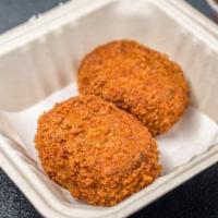 Croquette  · 2 pieces. Crispy Japanese potato panko with ground beef and onion.