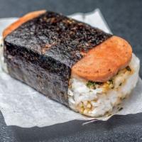 Spam Musubi · Crispy Spam, rice, Japanese Furikake, and Teriyaki sauce wrapped in seaweed.