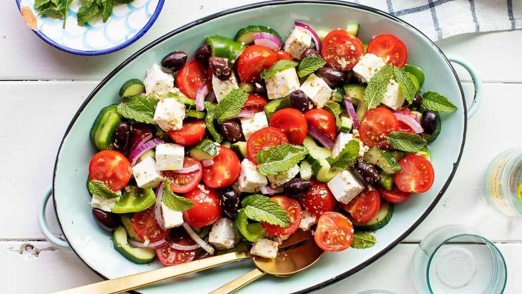 Greek Salad · Romaine, Tomatoes, Kalamata Olives, Cucumber, Bell Pepper, Pickled Red Onion, Feta, Red Wine Vinaigrette.