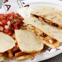 Quesadillas de Maiz · Two corn tortilla quesadillas, cheese, choice of meat or veggies with a side of pico de gall...