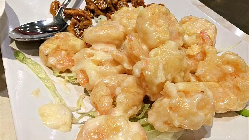 Honey Walnut Prawns (14 prawns) · Deep-fried prawns coated with sweet mayonnaise mixed glazed walnuts on the side and lettuces on the bottom.