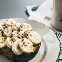 Peanut Butter Banana · Peanut butter, sliced bananas and honey topped with flax seeds.