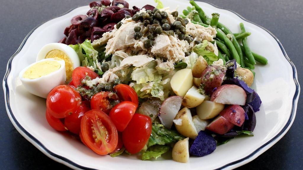 Nicoise · Romaine, tuna, tomatoes, olives, green beans, baby rainbow potatoes, hard-boiled egg, lemon vinaigrette.