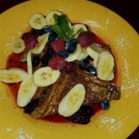 french toast with berry compote · clasic french toast banana and berries served with berries compote and