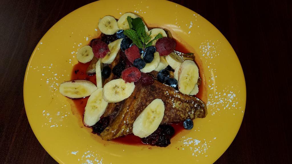 french toast with berry compote · clasic french toast banana and berries served with berries compote and