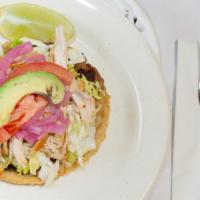 Panuchos · Fried corn tortilla filled with black beans, and choice of meat: chicken,or  poc chuc or car...