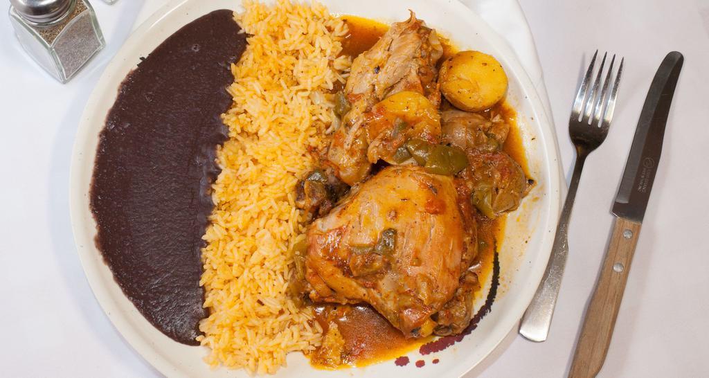 Pollo Con Papas · Chicken with potatoes served with refried beans and rice with homemade tortillas.