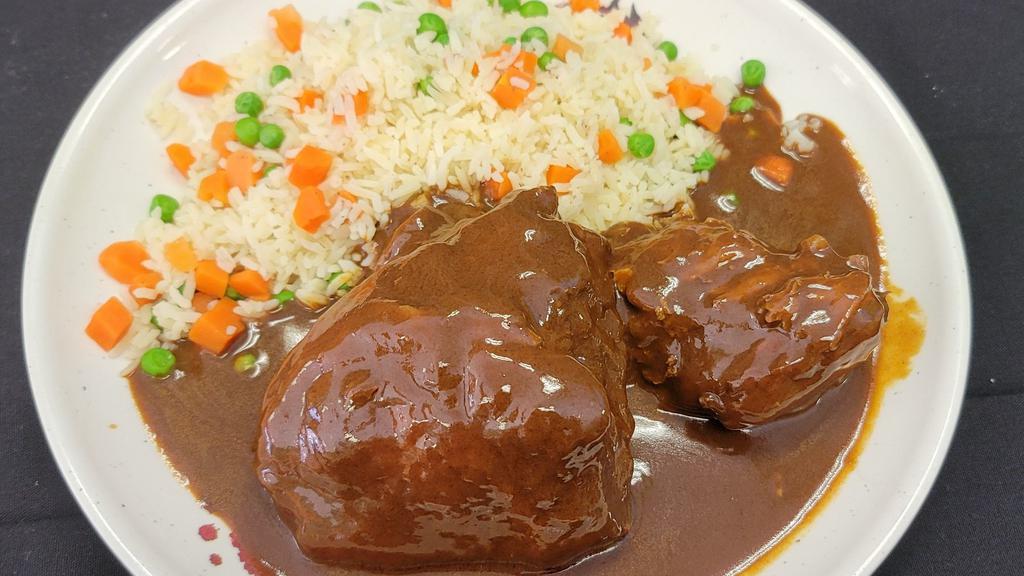 Chicken mole · Leg quarter chicken with delicius
Mole sauce served with rice and 
Home  made tortillas