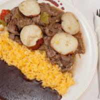 Bistec · Vegetarian. Fried steak with potatoes, tomatoes, onions, and black pepper served on a side o...