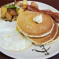 breakfast combo · 3 eggs 2 slice bacon  ,
2 plain pancake and house potatoes
