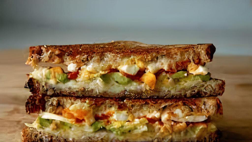 Avocado, Egg and Cheese Sandwich · Eggs with melted cheese and avocado.
