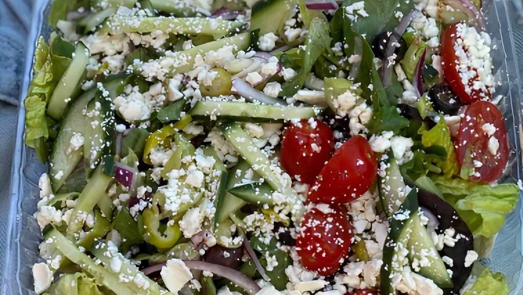 Greek Salad · Mixed green, kalamata and black olives, fresh tomatoes, cucumber, pepperoncini, red onions, and feta cheese, served with vinaigrette dressing.